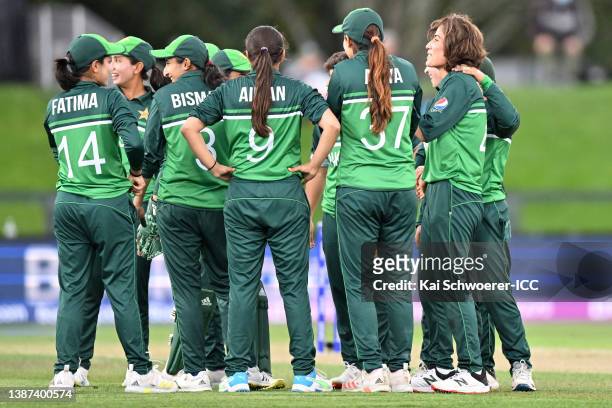 Diana Baig of Pakistan celebrates the wicket of Tammy Beaumont of England during the 2022 ICC Women's Cricket World Cup match between England and...