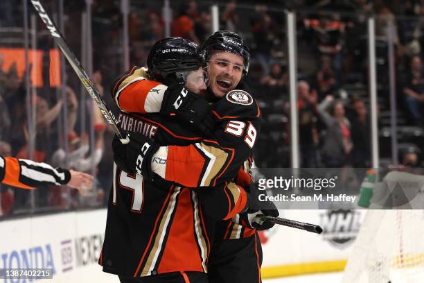Adam Henrique of the Anaheim Ducks congratulates Sam Carrick of the Anaheim Ducks after his goal during the third period of a game against the...