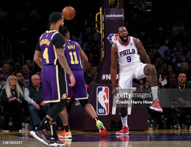 DeAndre Jordan of the Philadelphia 76ers celebrates his dunk in front of D.J. Augustin and Malik Monk of the Los Angeles Lakers during a 126-121...