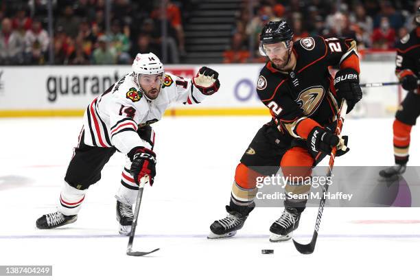 Kevin Shattenkirk of the Anaheim Ducks skates past the defense of Boris Katchouk of the Chicago Blackhawks during the third period of a game at Honda...