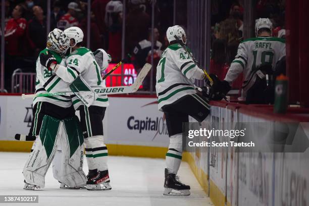 Jake Oettinger and Jamie Benn of the Dallas Stars celebrate after the game against the Washington Capitals during the third period of the game at...