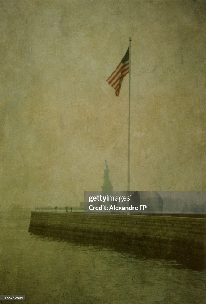 Statue of Liberty and American Flag on flagpole