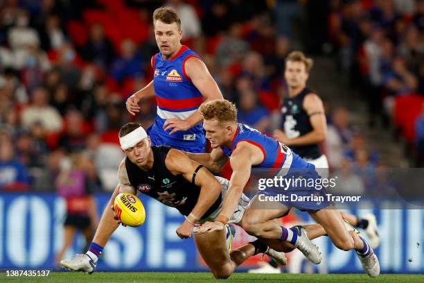 Adam Treloar of the Bulldogs is and Patrick Cripps of the Blues compete during the round two AFL match between the Western Bulldogs and the Carlton...