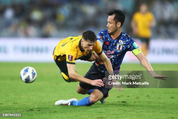 Maya Yoshida of Japan tackles Ajdin Hrustic of the Socceroos during the FIFA World Cup Qatar 2022 AFC Asian Qualifying match between the Australia...