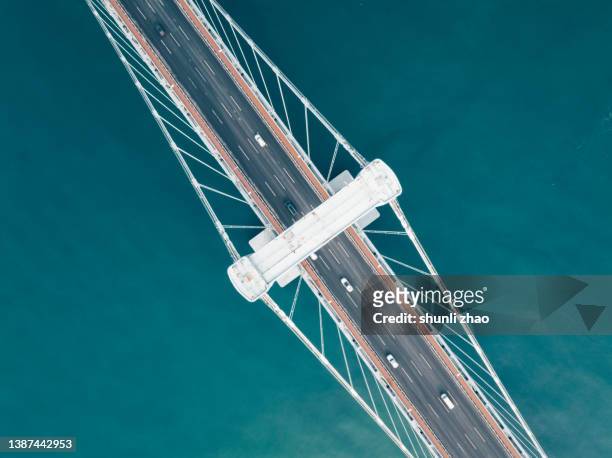 aerial view of cross-sea bridge - construction frame fotografías e imágenes de stock