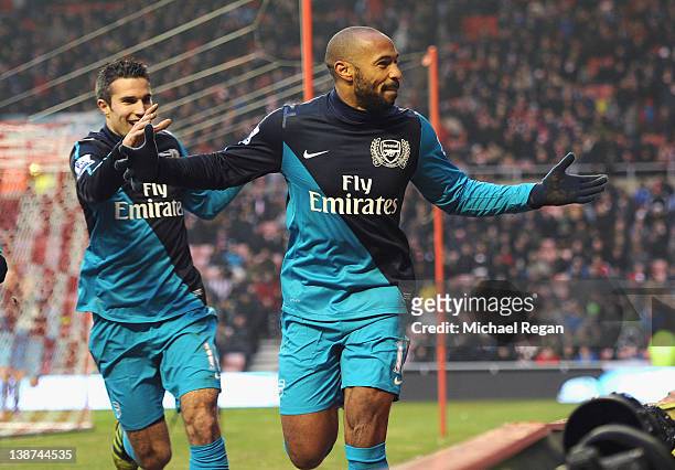 Thierry Henry of Arsenal celebrates scoring to make it 2-1 with Robin van Persie during the Barclays Premier League match between Sunderland and...