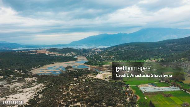 aerial view of the green hills and the mountains during scenic sunset in turkey - patara stock pictures, royalty-free photos & images
