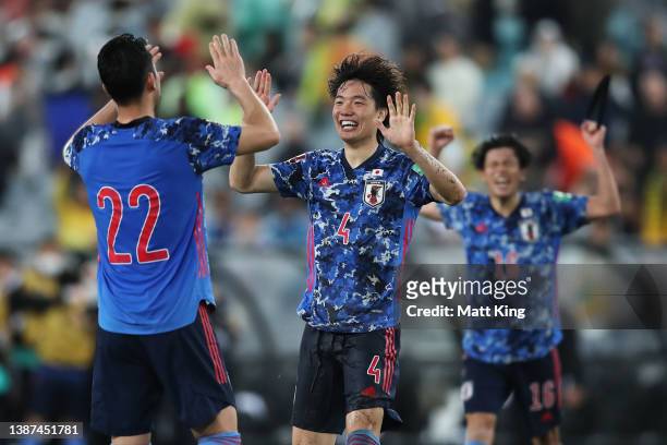 Kou Itakura of Japan celebrates victory with Maya Yoshida after the FIFA World Cup Qatar 2022 AFC Asian Qualifying match between the Australia...