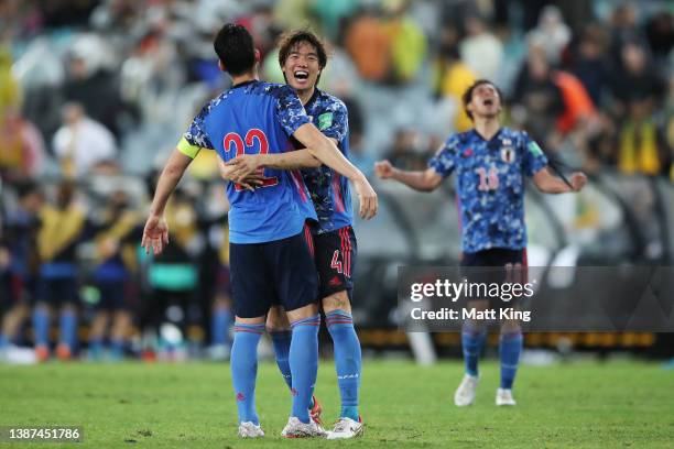 Kou Itakura of Japan celebrates victory with Maya Yoshida after the FIFA World Cup Qatar 2022 AFC Asian Qualifying match between the Australia...