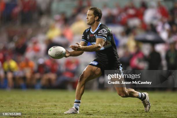 Matt Moylan of the Sharks passes during the round three NRL match between the St George Illawarra Dragons and the Cronulla Sharks at WIN Stadium on...