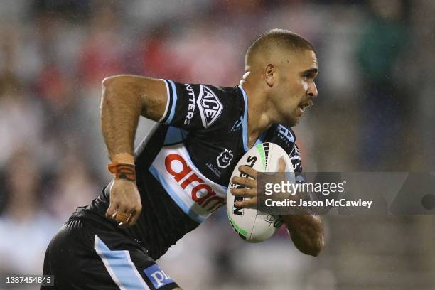 William Kennedy of the Sharks runs the ball during the round three NRL match between the St George Illawarra Dragons and the Cronulla Sharks at WIN...