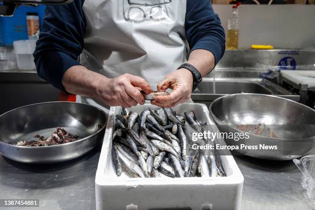 Vendor cleans fish at a fish stall in the Central Market of Valencia, on 24 March, 2022 in Valencia, Valencian Community, Spain. The Association of...