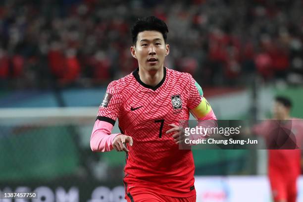 Son Heung-Min of South Korea celebrates after scoring team's first goal during the FIFA World Cup Asian Qualifier Final Round Group A match between...