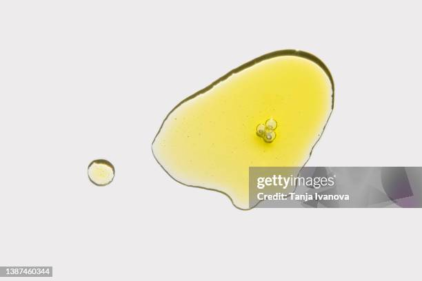 drop of cosmetic liquid on a white background. peptides, ceramidam, polyglutamic acid, essential oil, cbd, retinol. cosmetic skin care product. - aromatherapy oil stockfoto's en -beelden