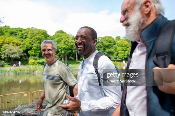 fun in the sun - diversity month stock pictures, royalty-free photos & images