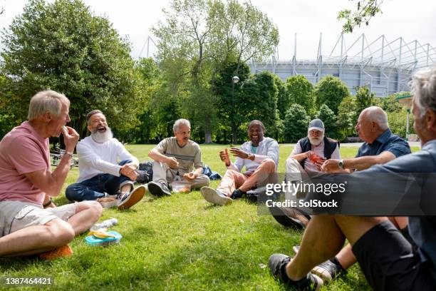 a sunny spot for lunch - senior men eating stock pictures, royalty-free photos & images
