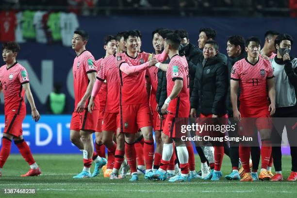 Son Heung-Min of South Korea celebrates with team mates after the FIFA World Cup Asian Qualifier Final Round Group A match between South Korea and...