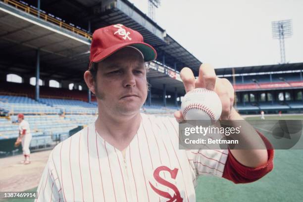 American baseball pitcher Wilbur Wood, of the Chicago White Sox, demonstrates his 'knuckle ball' at the club's Comiskey Park stadium in Chicago,...