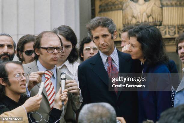 American researcher Tony Russo and American economist and political activist Daniel Ellsberg address the media during a recess in their trial at the...