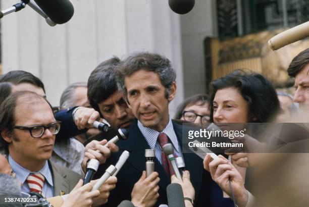 American researcher Tony Russo and American economist and political activist Daniel Ellsberg address the media during a recess in their trial at the...