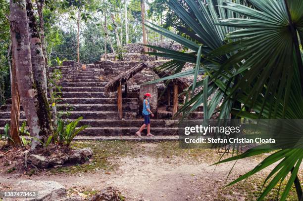 girl exploring coba archeological site, quintana roo, mexico - mayan ruin stock pictures, royalty-free photos & images