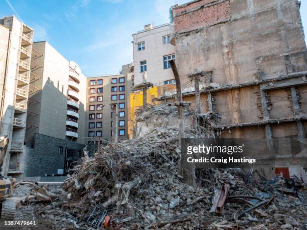 close up shot of soviet  era eastern europe style building with war conflict style damage such as shells, bullets and explosions. - demolish foto e immagini stock