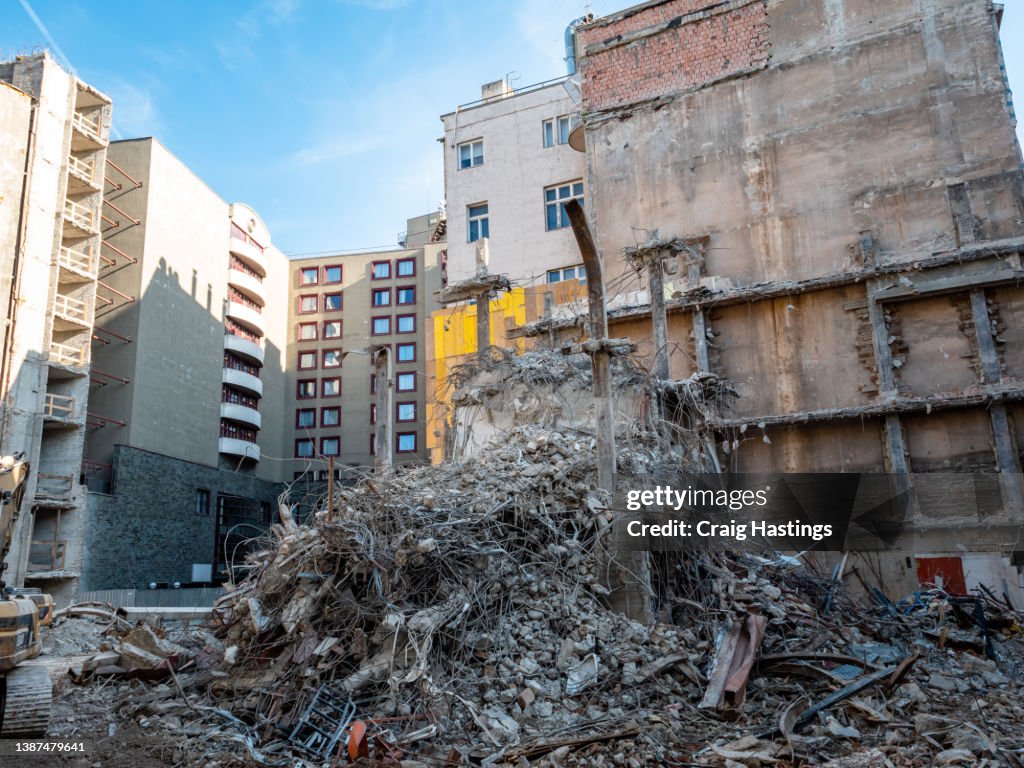 Close up Shot of soviet era Eastern Europe style building with war conflict style damage such as shells, bullets and explosions.