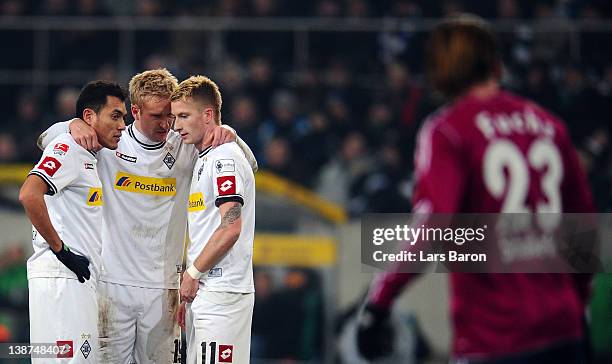 Juan Arango, Mike Hanke and Marco Reus stand together during the Bundesliga match between Borussia Moenchengladbach and FC Schalke 04 at Borussia...