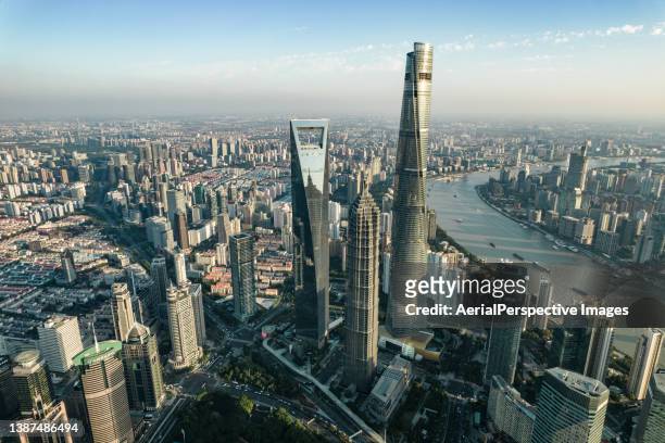 shanghai skyline at sunset - shanghai sunset stock pictures, royalty-free photos & images
