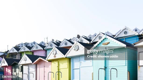 panoramic view of colourful beach huts - beach house stock pictures, royalty-free photos & images