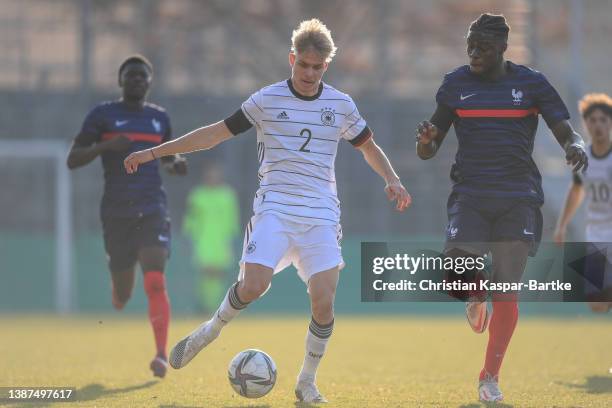 Stefano Morgalla of Germany challenges Chimuanya Ugochukwu of France during the international friendly match between Germany U18 and France U18 at...