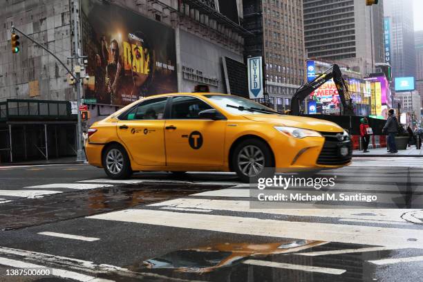 Yellow cab taxi is seen on March 24, 2022 in New York City. Uber announced that it will begin to list all New York City taxis through its app...