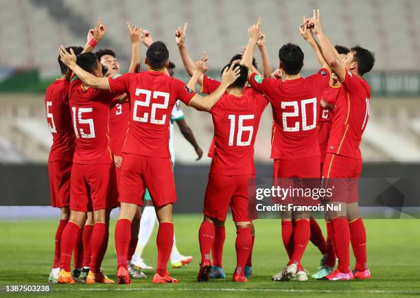 Players of China celebrates their first goal during the FIFA World Cup Asian Qualifying match between China v Saudi Arabia at Sharjah Football...