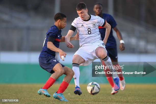 Marcel Wenig of Germany challenges Kevin Danois of France during the international friendly match between Germany U18 and France U18 at GAZI-Stadion...