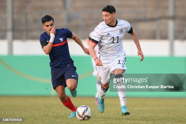 Yusuf Kabadayi of Germany challenges Mohamed El Arouch of France during the international friendly match between Germany U18 and France U18 at...