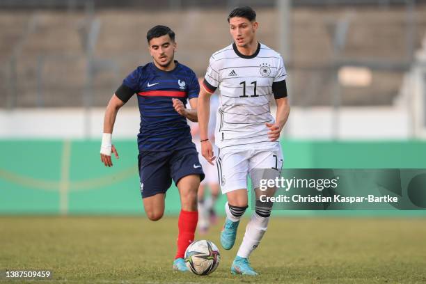 Yusuf Kabadayi of Germany challenges Mohamed El Arouch of France during the international friendly match between Germany U18 and France U18 at...