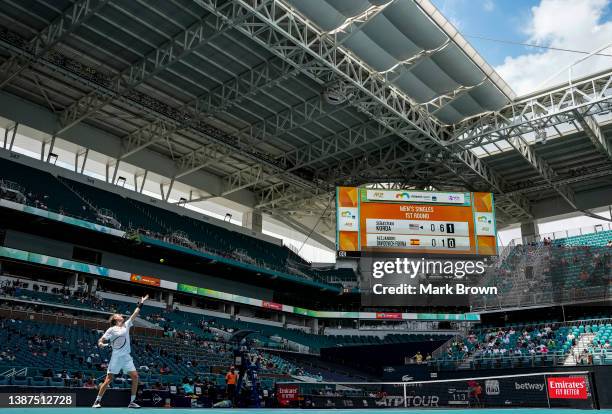 Sebastian Korda of United States serves to Alejandro Davidovich Fokina of Spain during the 2022 Miami Open presented by Itaú at Hard Rock Stadium on...