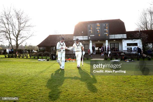 Middlesex batsmen make their way out after tea during the pre-season friendly match between Middlesex and Kent at Merchant Taylors' School on March...