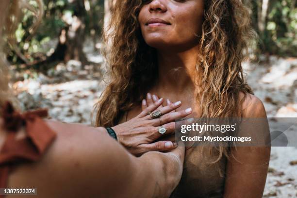 two young women healing each other, reiki concept - chakra bildbanksfoton och bilder