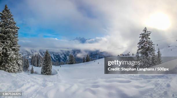 ski slope in clear weather,scenic view of snow covered mountains against sky,montafon,austria - montafon valley stock pictures, royalty-free photos & images