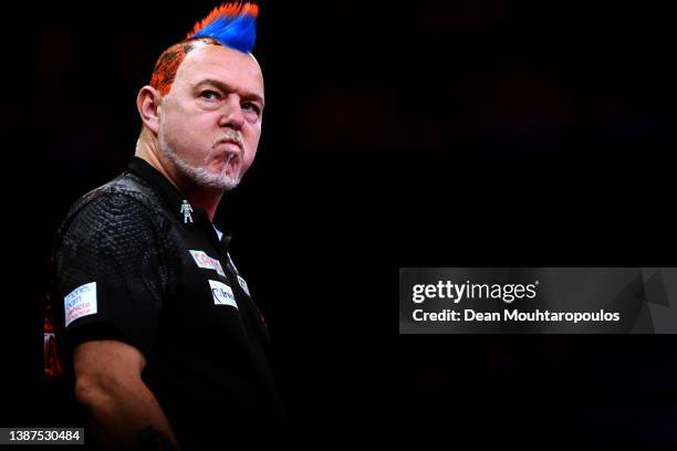 Peter 'Snakebite' Wright of Scotland competes against James 'The Machine' Wade of England during Night 7 of Cazoo Premier League Darts on at...