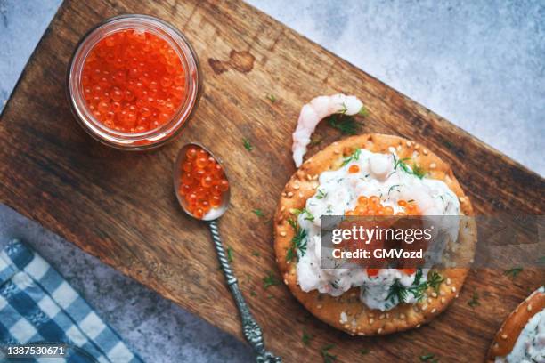 skagen toast scandinavian prawn cocktail with fish roe - caviar stock pictures, royalty-free photos & images