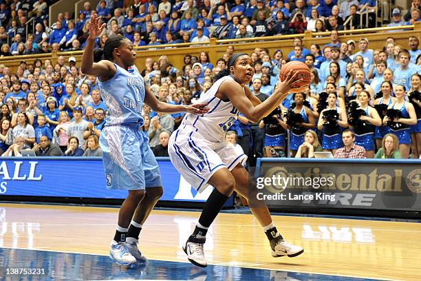 Richa Jackson of the Duke Blue Devils drives past She'la White of the North Carolina Tar Heels at Cameron Indoor Stadium on February 6, 2012 in...