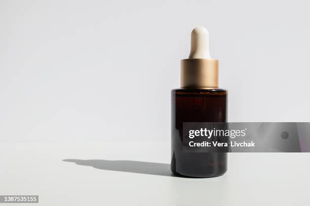 glass bottles for cosmetics with pipette - blood serum stock pictures, royalty-free photos & images