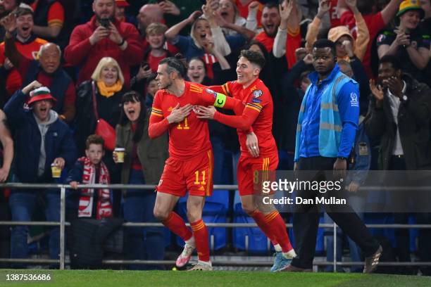 Gareth Bale of Wales celebrates with teammate Harry Wilson after scoring their team's second goal during the 2022 FIFA World Cup Qualifier knockout...