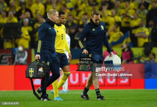 Martin Olsson of Sweden leaves the pitch after receiving medical treatment during the 2022 FIFA World Cup Qualifier knockout round play-off match...