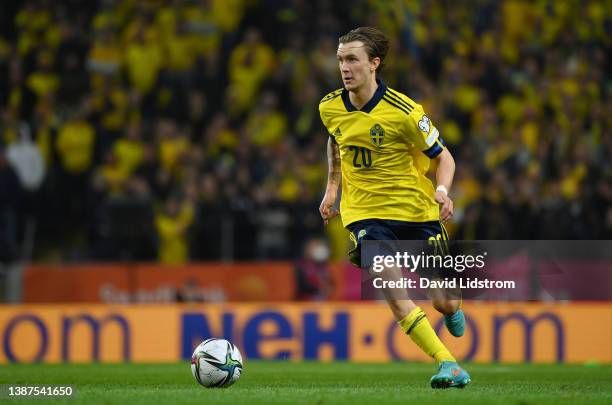 Kristoffer Olsson of Sweden runs with the ball during the 2022 FIFA World Cup Qualifier knockout round play-off match between Sweden and Czech...