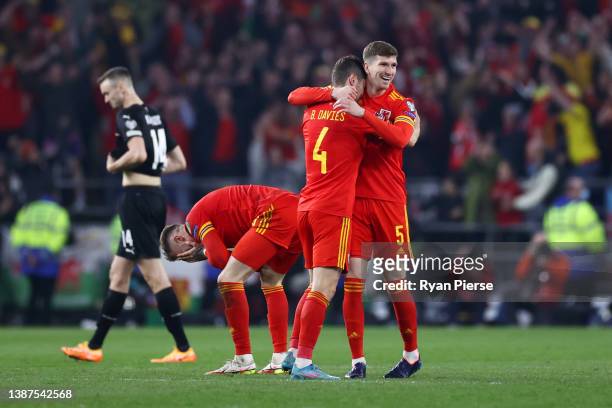 Ben Davies and Chris Mepham of Wales celebrate following their side's victory in the 2022 FIFA World Cup Qualifier knockout round play-off match...