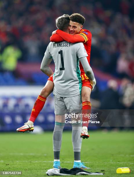 Ethan Ampadu and Wayne Hennessey of Wales celebrate following their side's victory in the 2022 FIFA World Cup Qualifier knockout round play-off match...