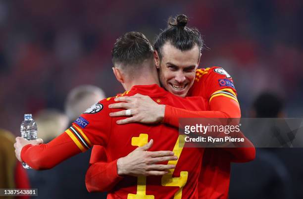 Gareth Bale and Connor Roberts of Wales celebrate following their side's victory in the 2022 FIFA World Cup Qualifier knockout round play-off match...
